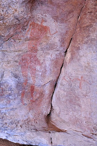 Lifesize painting of a man, neolithic rock art in the Tadrart, Tassili n'Ajjer National Park, Unesco World Heritage Site, Algeria, Sahara, North Africa