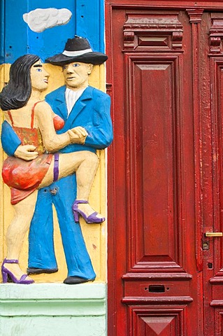 Facade relief of man and woman, El Caminito street, La Boca district, Buenos Aires, Argentina, South America