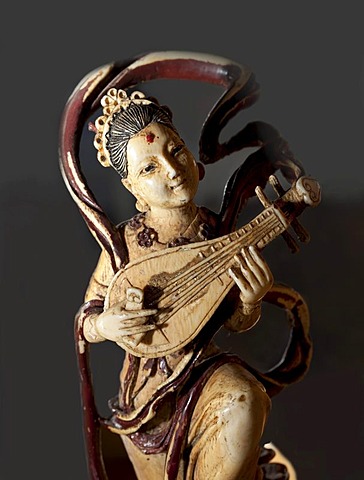 Carved ivory figurine, woman playing a pipa, a traditional Chinese lute, East Asia exhibition at the Haus Kemnade moated castle, Hattingen, North Rhine-Westphalia, Germany, Europe