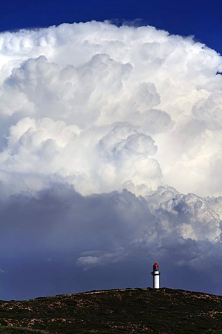 Point Quobba Lighthouse with big rain cloud in the distance, Western Australia