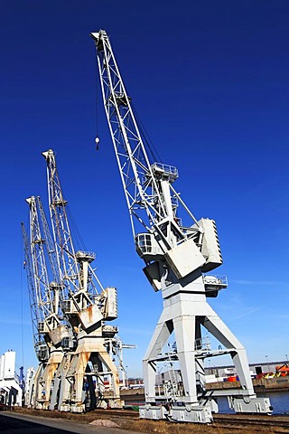Old disused cranes in the free port, Hamburg, Germany