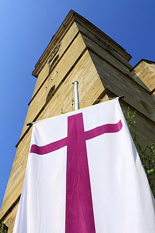 Protestant church flag on the market place in front of the spire of the protestant church of St. Peter and Paul, Oehringen, Hohenlohe, Baden-Wuerttemberg, Germany, Europe