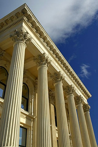 The facade of a typical limestone building with columns, in downtown Oamaru, South Island, New Zealand