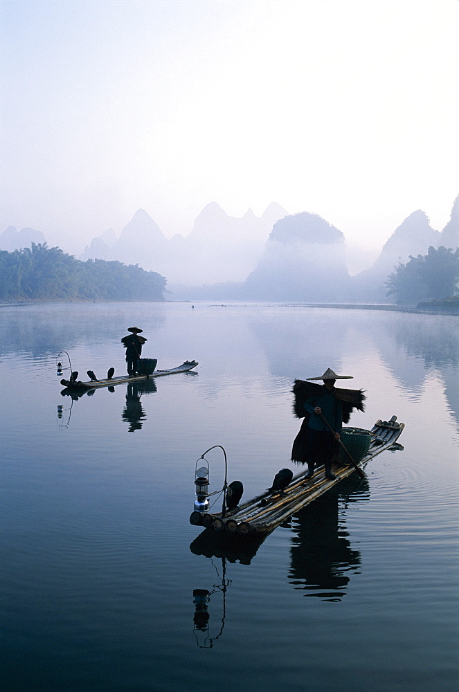 Cormorant fishermen at dawn on the Li River, Guilin, Yangshou, Guangxi Province, China, Asia