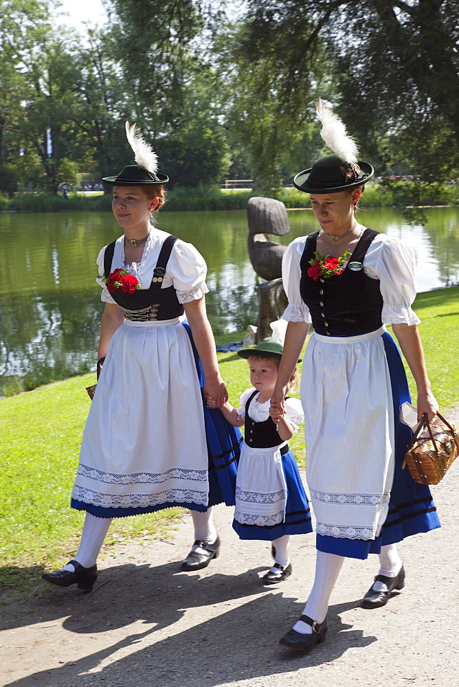 Women and child in Bavarian costume, Munich, Germany, Europe