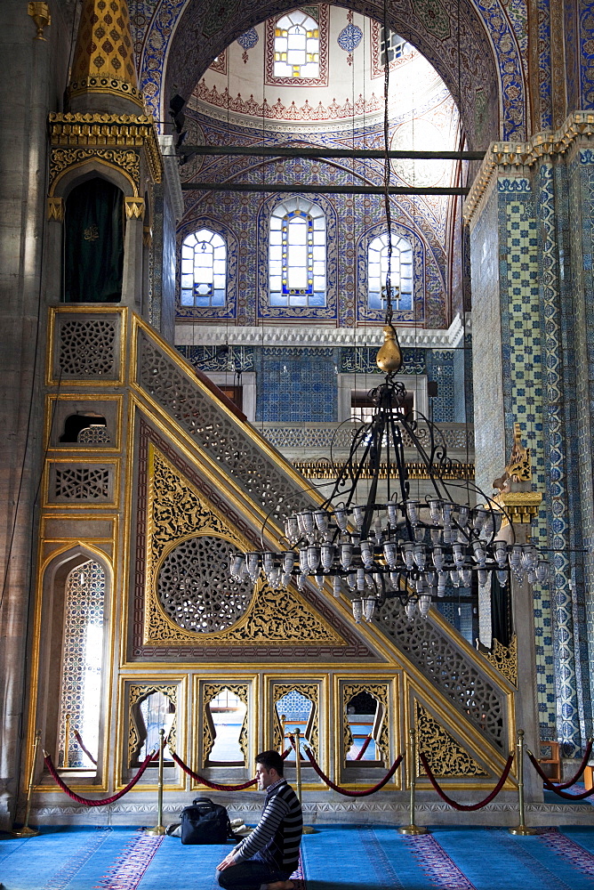 Man praying in the Arpaciliar Mosque (New Mosque), Istanbul, Turkey, Europe