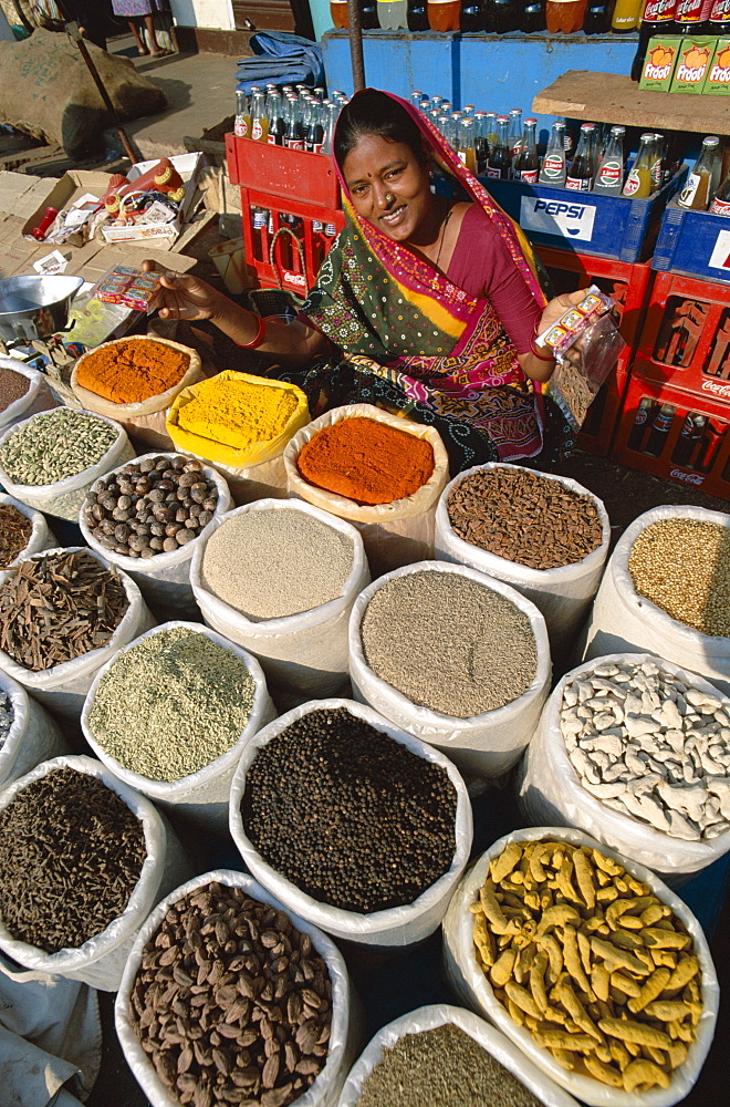 Vendor selling curry powder and spices, Anjuna Market, Goa, India, Asia