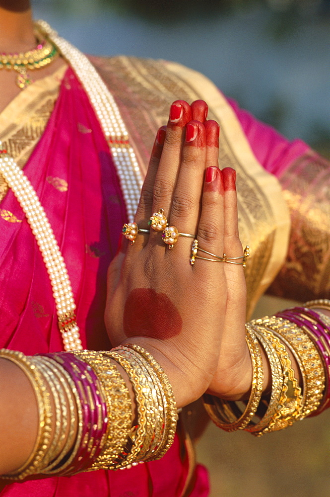 Traditional costume and detail of hands in traditional Indian greeting pose, Mumbai (Bombay), Maharastra, India, Asia