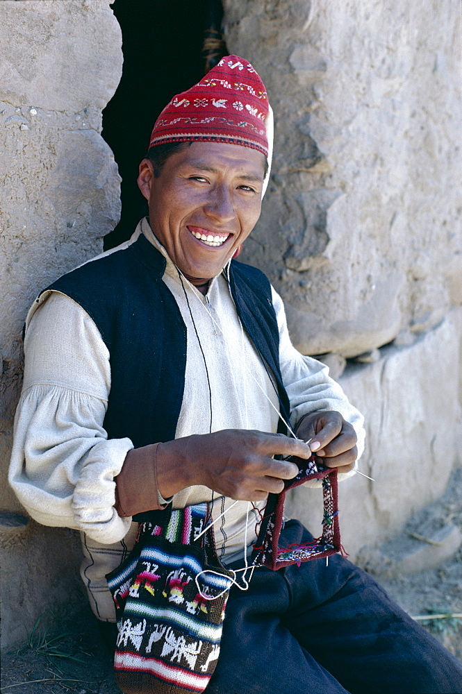 Man knitting, Taquile Island, Lake Titicaca, Peru, South America