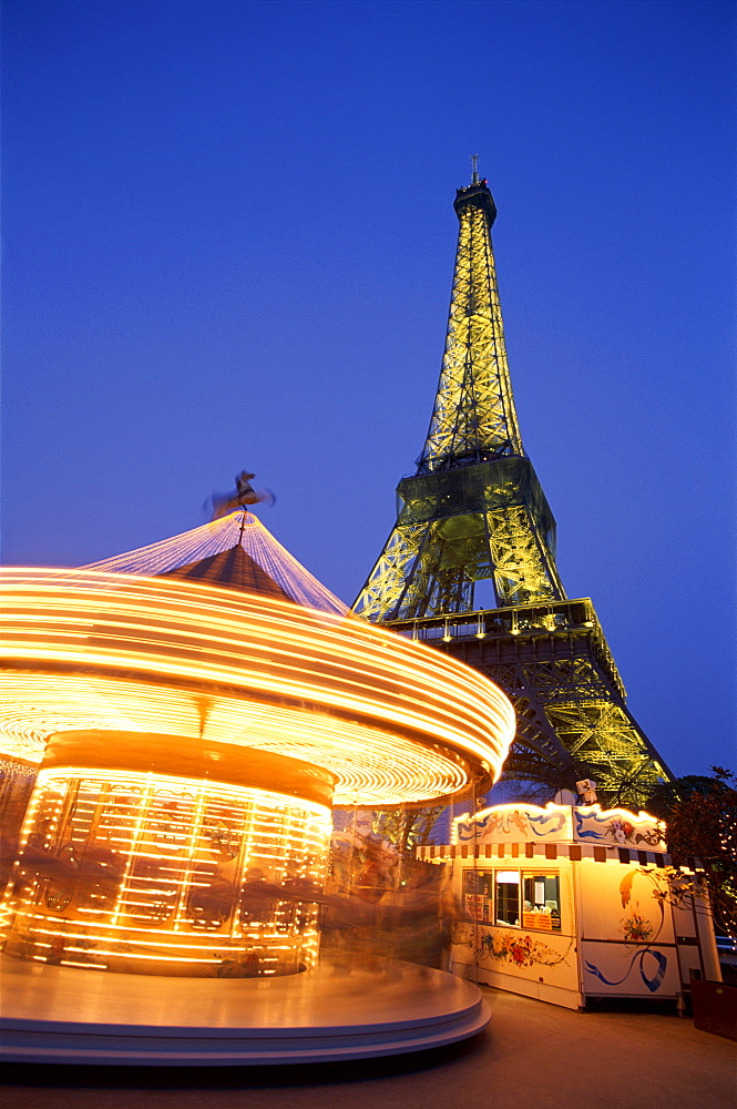 Eiffel Tower (Tour Eiffel) with carousel at night, Paris, France, Europe