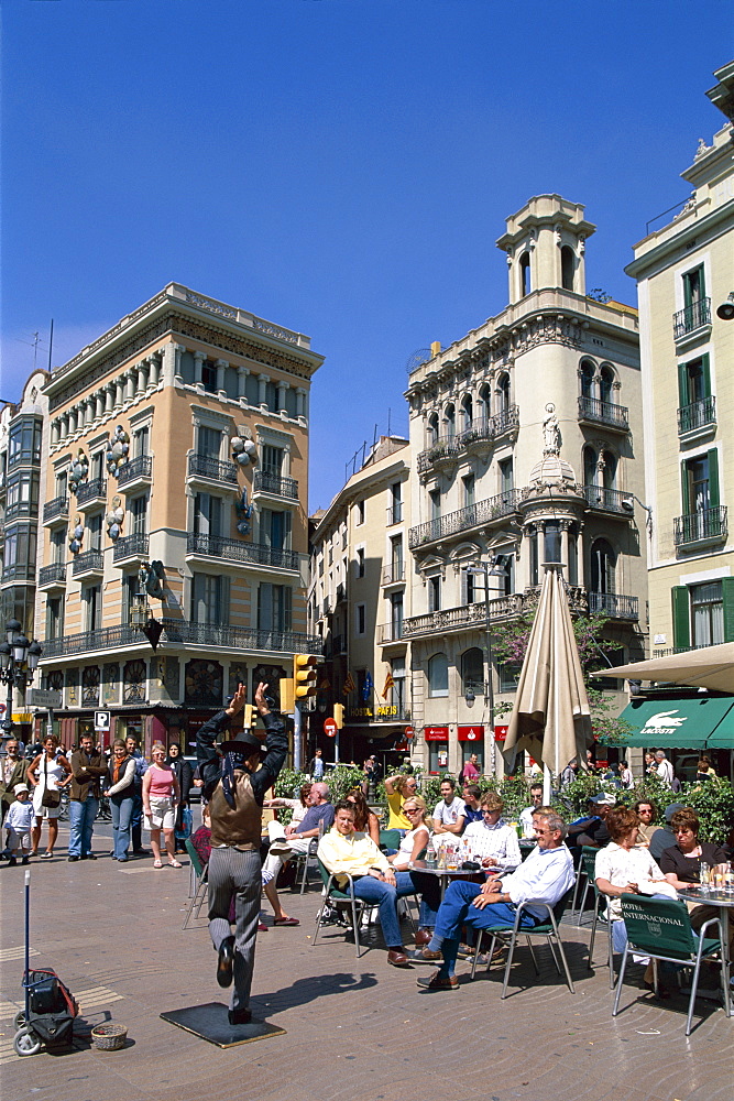 Outdoor cafes and street performer, La Ramblas, Barcelona, Catalonia, Spain, Europe