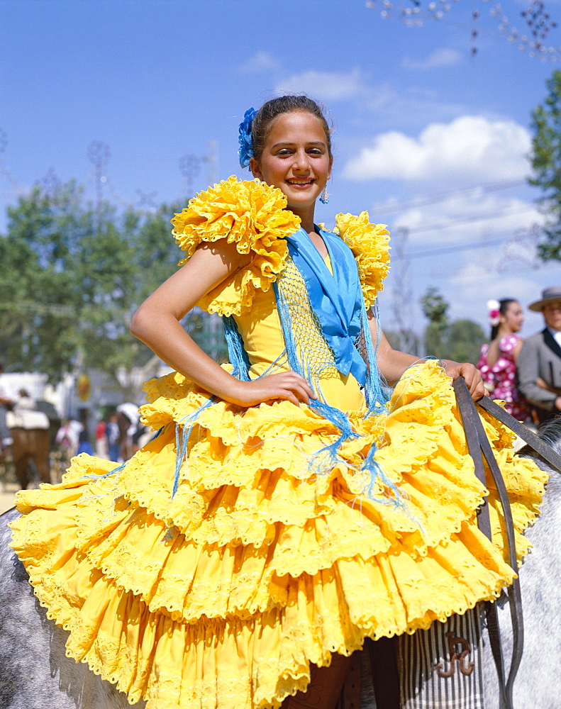 Girl dressed in Andalucian costume at the Horse Fair (Fiesta), Jerez de la Frontera, Andalusia, Spain, Europe