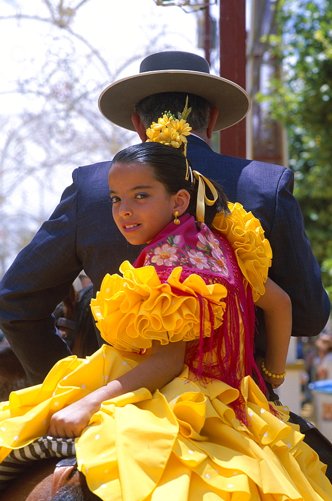 Girl dressed in Andalucian costume at the Horse Fair (Fiesta), Jerez de la Frontera, Andalusia, Spain, Europe