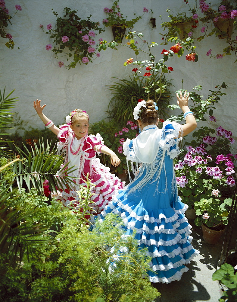 Girls dressed in Andalucian costume at the Horse Fair (Fiesta), Jerez de la Frontera, Andalusia, Spain, Europe