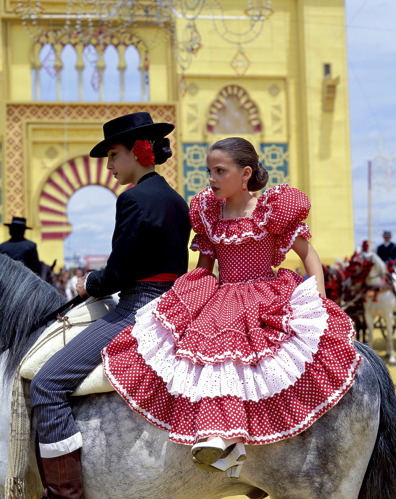 Girls dressed in Andalucian costume at the Horse Fair (Fiesta), Jerez de la Frontera, Andalusia, Spain, Europe