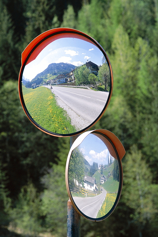 Reflection in road mirrors of roads and fields, Dolomites, Italy, Europe