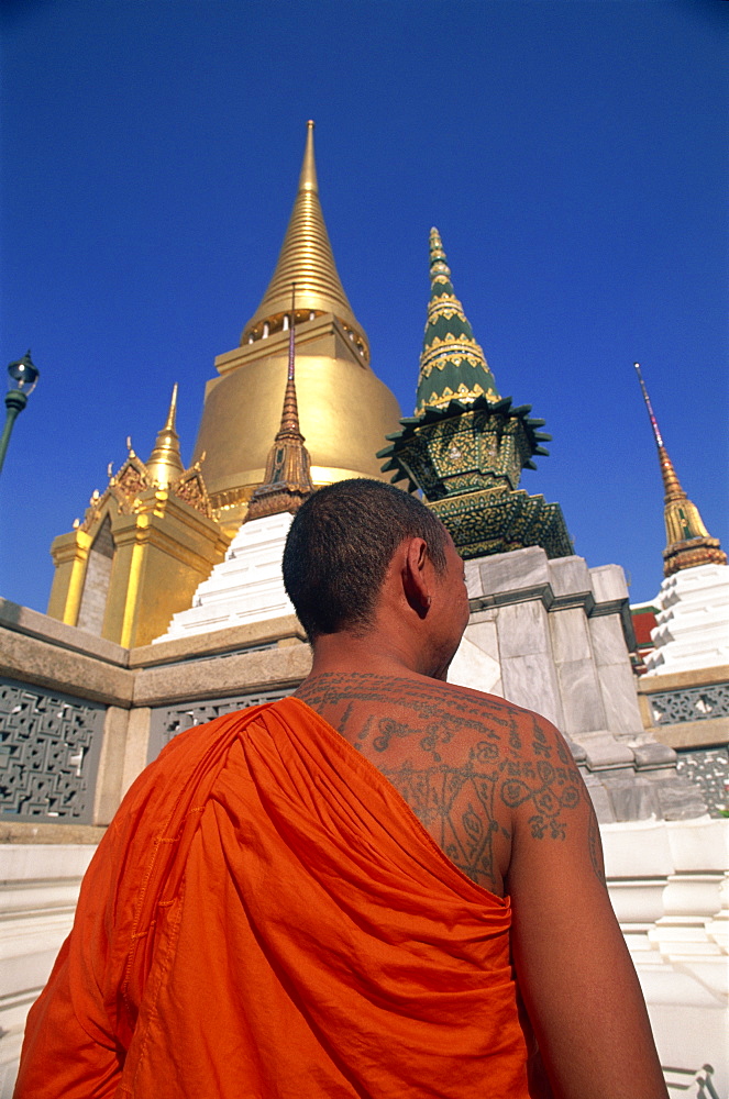 Buddhist monk with tattoo Wat Phra Kaew, Grand Palace, Bangkok, Thailand, Southeast Asia, Asia