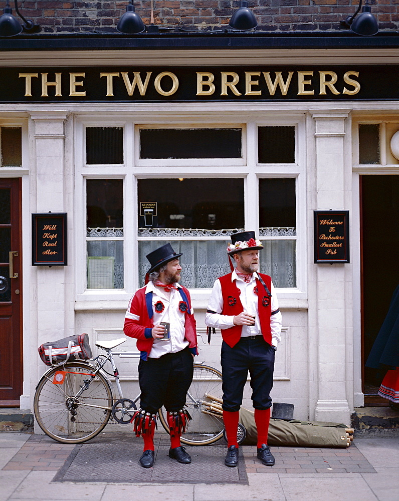 Two Morris Dancers drinking outside pub, Rochester, Kent, England, United Kingdom, Europe