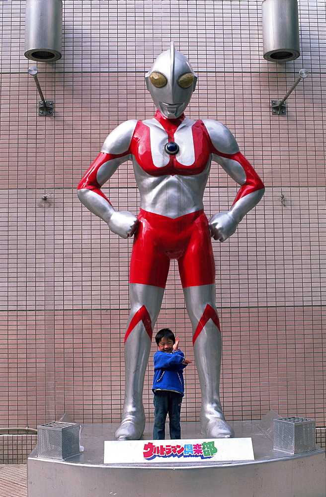 Ultraman statue and young child in Asakusa, Tokyo, Honshu, Japan, Asia