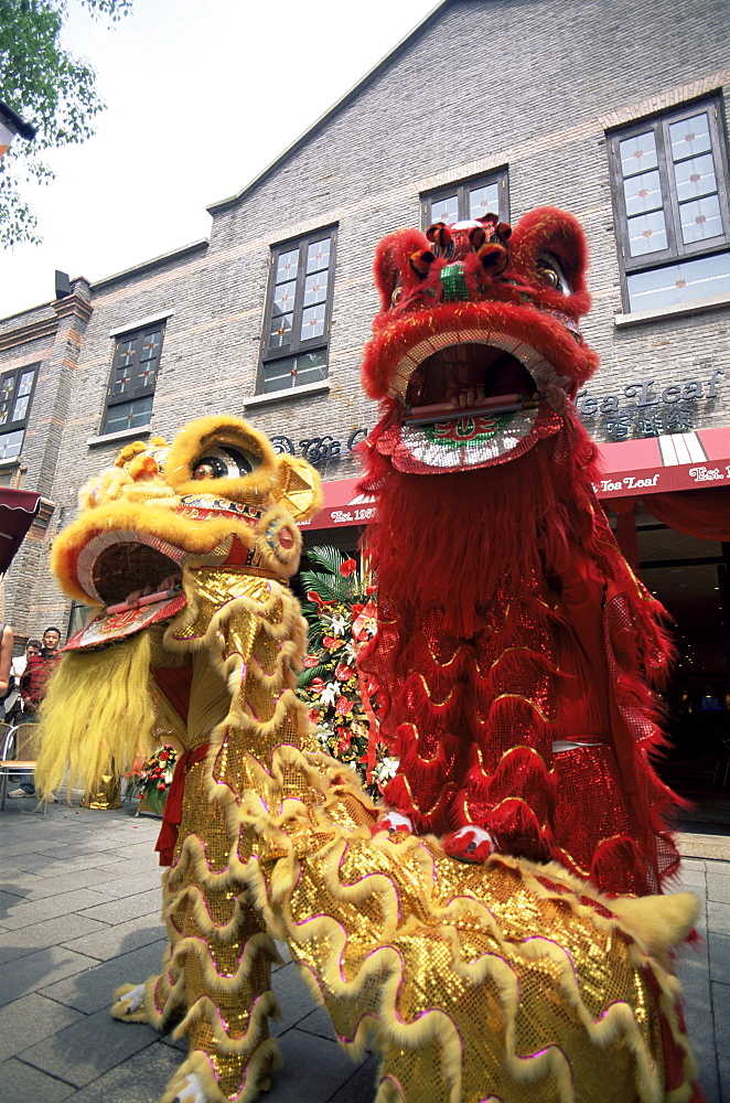 Lion dance performance celebrating the opening of a new business, Xintiandi, French Concession Area, Shanghai, China, Asia