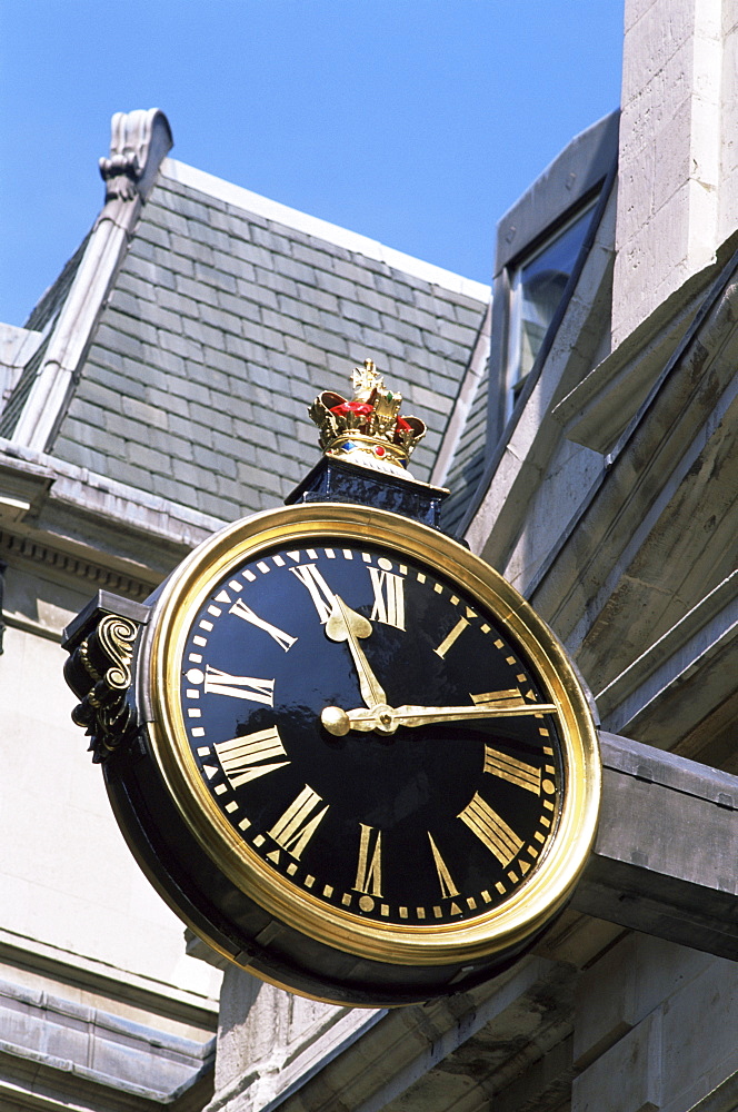 Clock in Lombard Street, City of London, London, United Kingdom, Europe