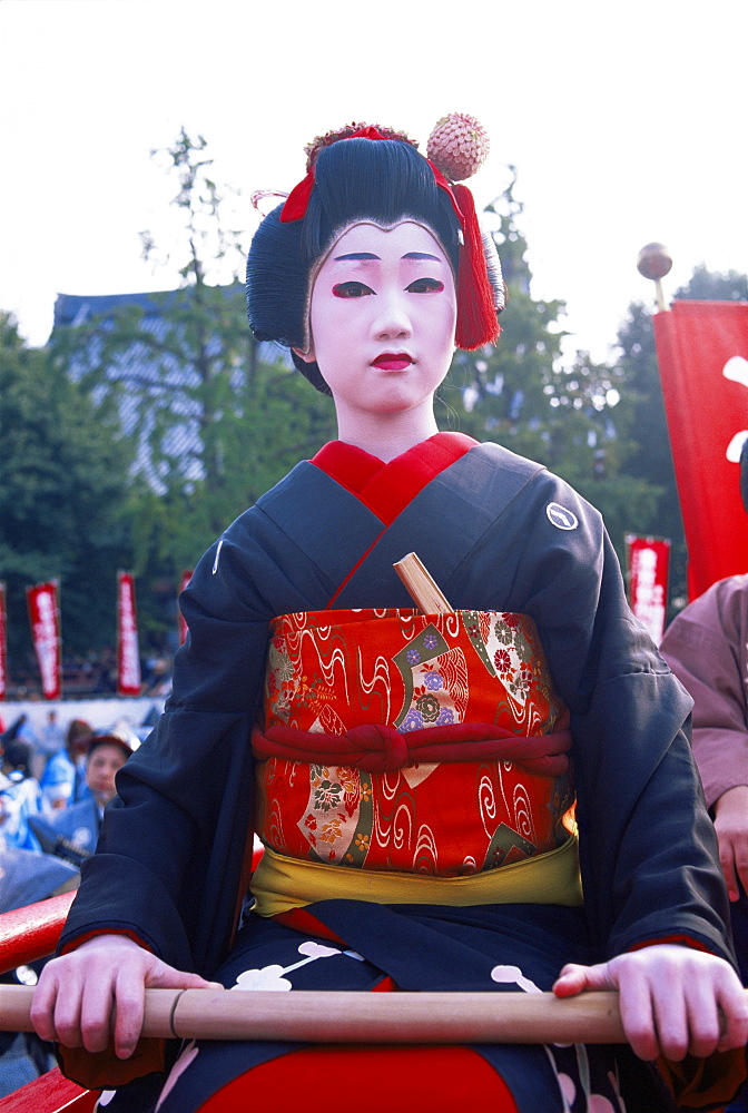 Young girl dressed as a geisha at the Jidai Matsuri Festival held annually in November at Sensoji Temple, Asakusa, Tokyo, Japan, Asia