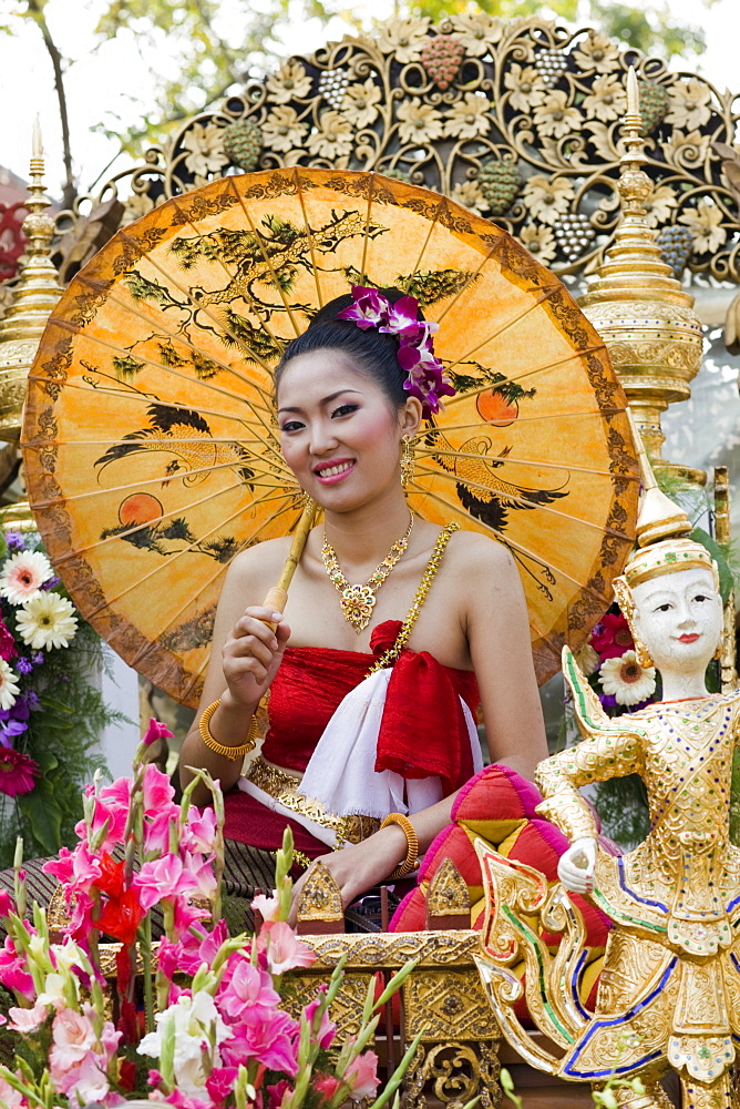 Girl on floral float at Chiang Mai Flower Festival Parade, Chiang Mai, Thailand, Southeast Asia, Asia