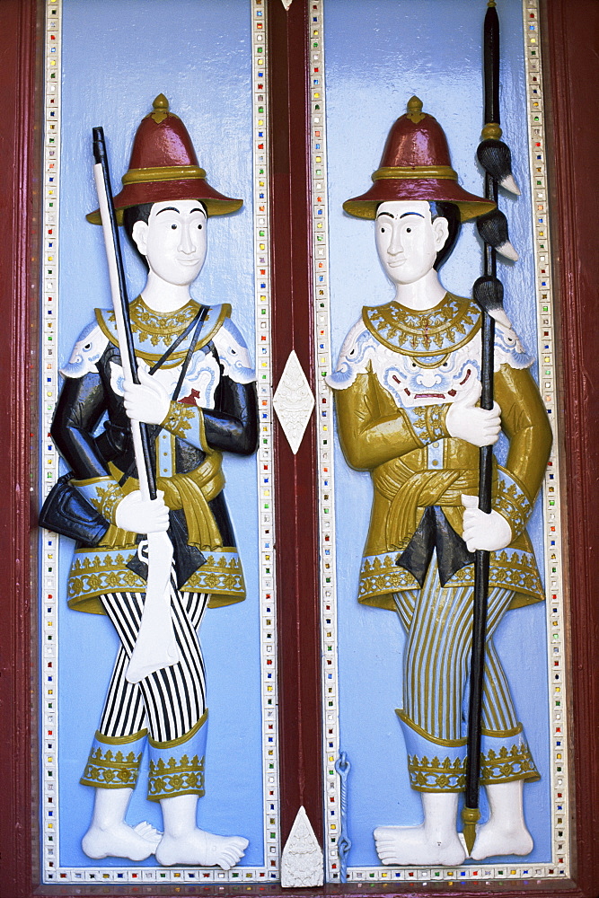 Door carving detail of royal guards, Grand Palace, Bangkok, Thailand, Southeast Asia, Asia