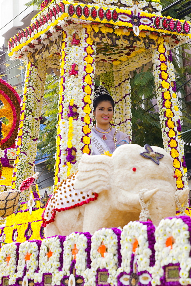 Girl on floral float at Chiang Mai Flower Festival Parade, Chiang Mai, Thailand, Southeast Asia, Asia