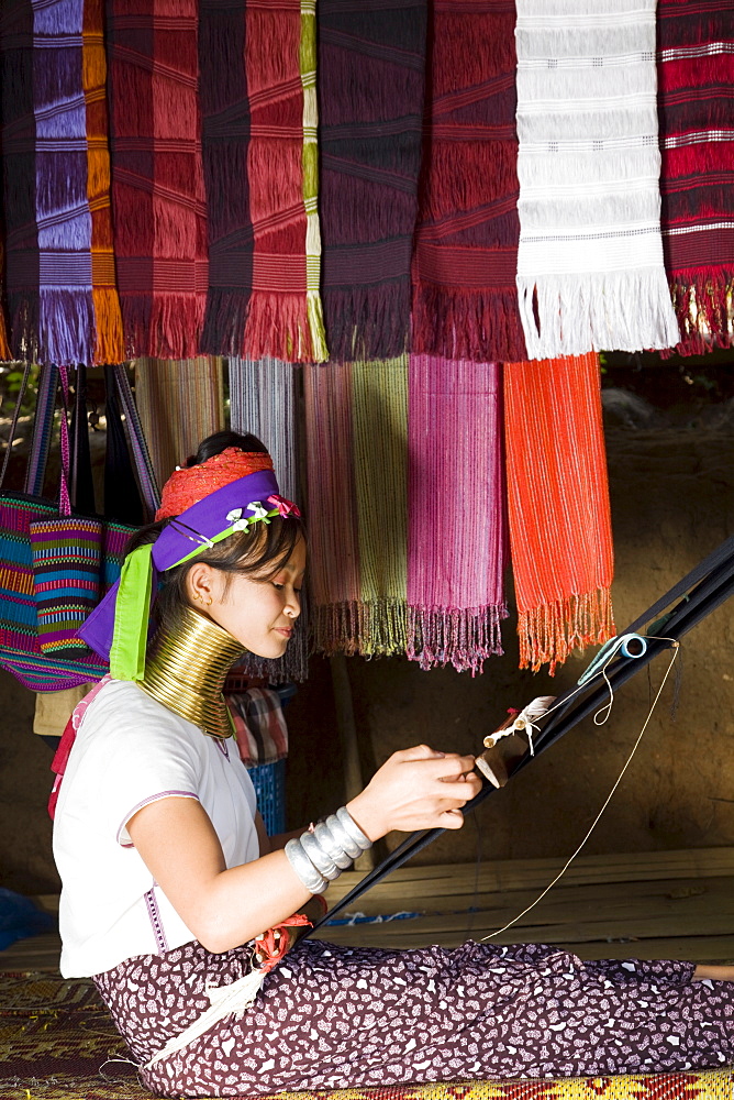 Long Neck Karen hill tribe girl weaving, Chiang Rai, Golden Triangle, Thailand, Southeast Asia, Asia