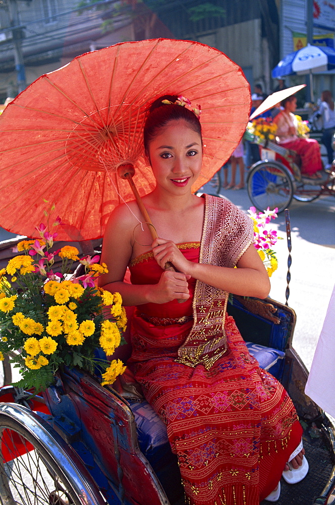 Girl sitting in trishaw at the Chiang Mai Flower Festival Parade, Chiang Mai, Thailand, Southeast Asia, Asia