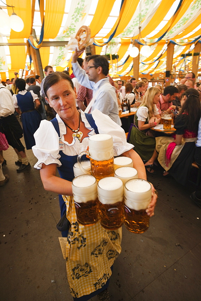 Waitress with beer steins, Oktoberfest, Munich, Bavaria, Germany, Europe