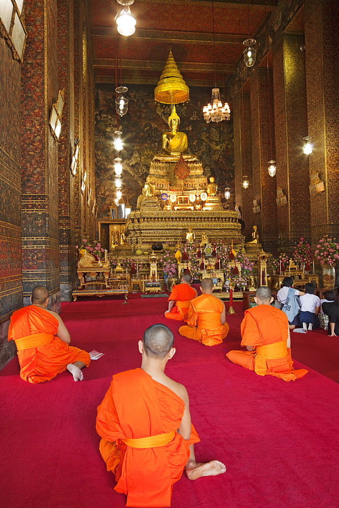 Buddhist monks praying in the main chapel, Wat Pho, Bangkok, Thailand, Southeast Asia, Asia