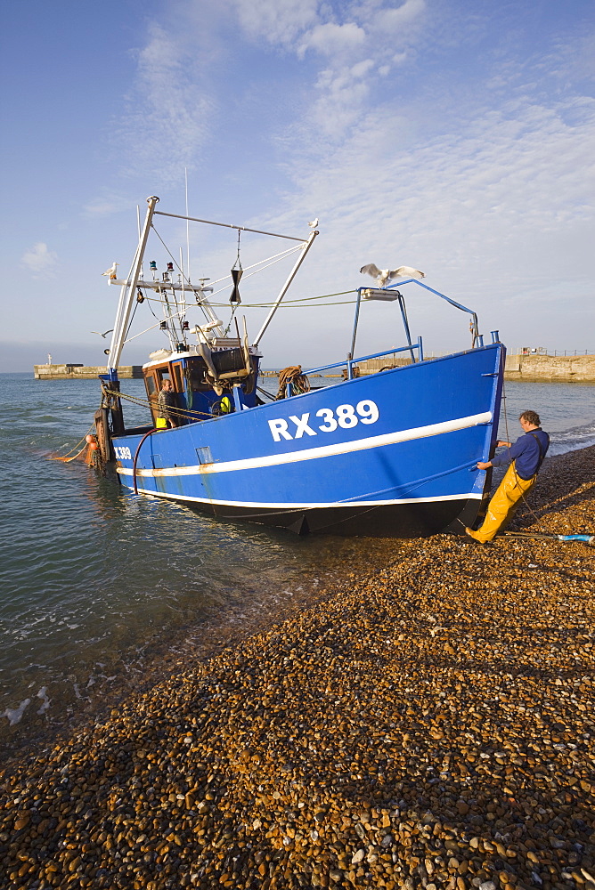 The Stade, shore based fishing boat returning to port, Hastings, East Sussex, England, United Kingdom, Europe