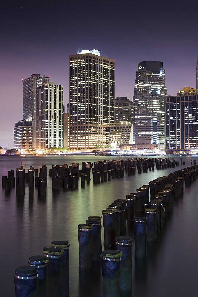 Downtown Manhattan skyline and the remains of an old pier at the base of the Brooklyn Bridge Park in New York, New York State, United States of America, North  America