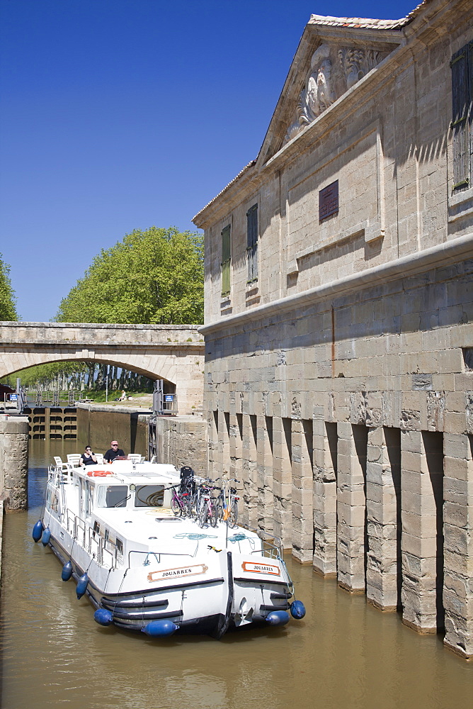 A barge on the Canal du Midi, UNESCO World Heritage Site, in spring, Languedoc-Roussillon, France, Europe.