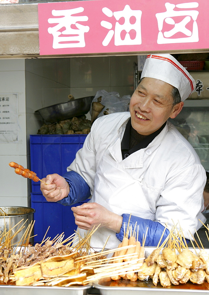 Snack vendor in family business, Chengdu, Sichuan Province, China, Asia