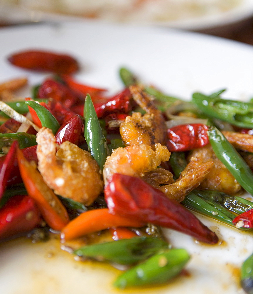 Colorful and spicy Sichuan cuisine shrimp dish uses both red and green chili peppers, Chongqing, Sichuan, China, Asia