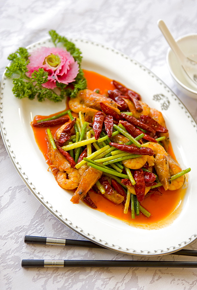 Colorful and spicy Sichuan cuisine dishes use both red and green chili peppers, eaten with chopsticks, Chengdu, Sichuan, China, Asia