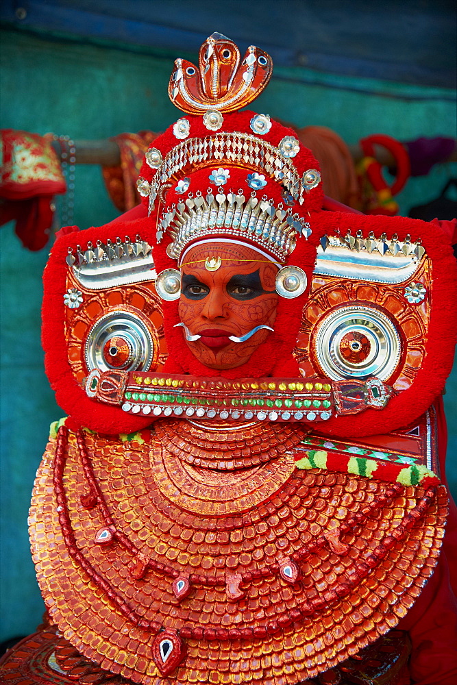 Man in costume representing a god at the Teyyam ceremony, near Kannur, Kerala, India, Asia