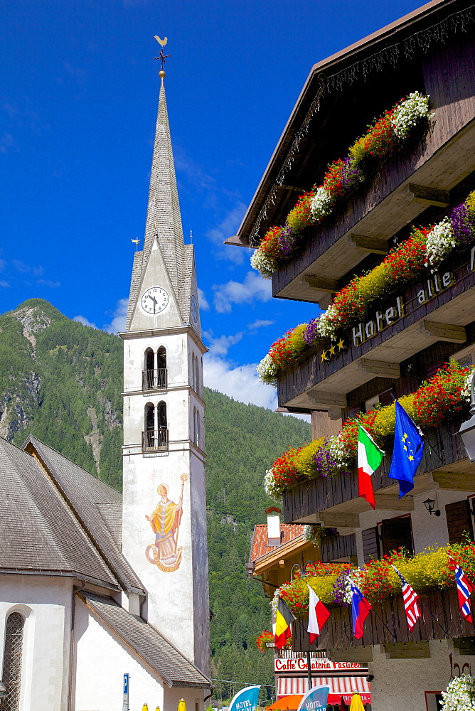 Church and hotel, Alleghe, Belluno Province, Italian Dolomites, Italy, Europe