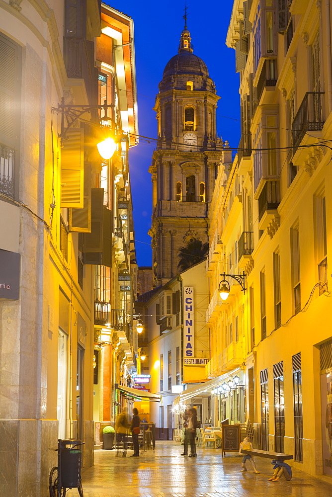 View of Malaga Cathedral from Calle Marques de Larios at dusk, Malaga, Costa del Sol, Andalusia, Spain, Europe