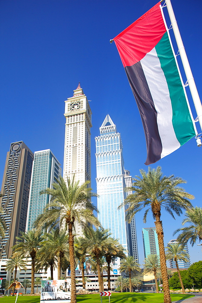 Skyscrapers on Sheikh Zayed Road and the Emirates flag, Dubai, United Arab Emirates, Middle East