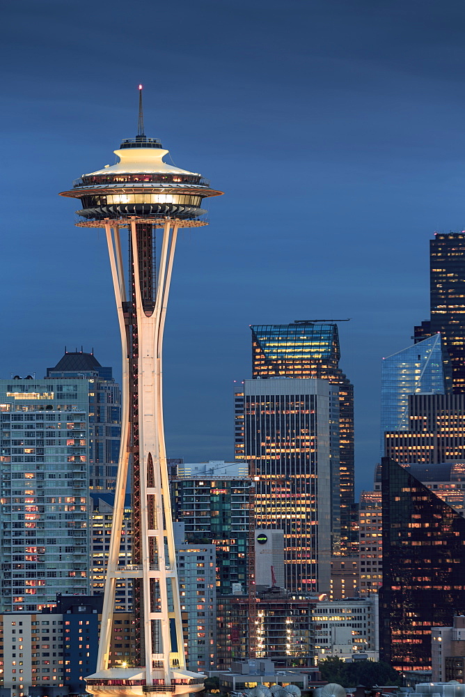 Seattle city skyline at night with illuminated office buildings and Space Needle viewed from public garden near Kerry Park, Seattle, Washington State, United States of America, North America