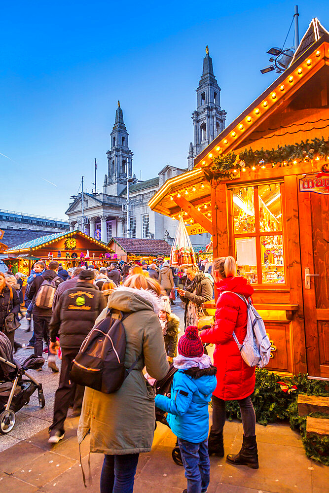 View of visitors and Christmas Market stalls at Christmas Market, Millennium Square, Leeds, Yorkshire, England, United Kingdom, Europe