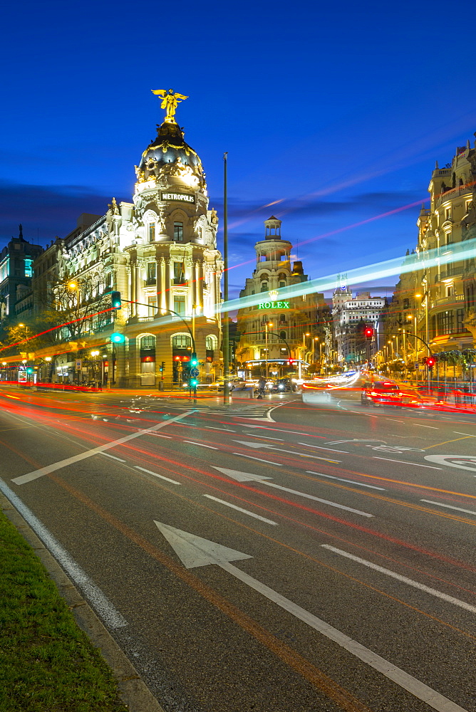 View of trail lights on Calle de Alcala and the entry to Gran Via at dusk, Madrid, Spain, Europe