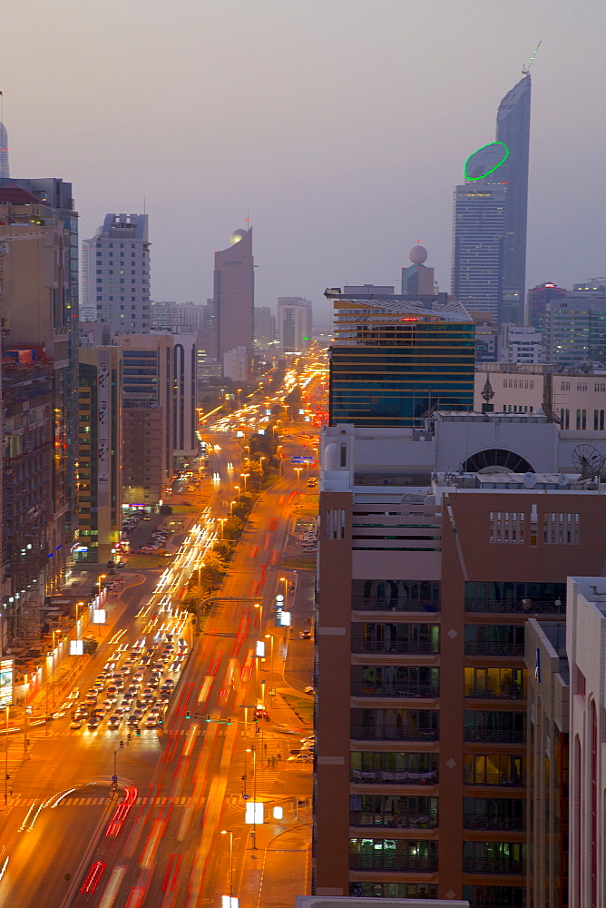 City skyline and Rashid Bin Saeed Al Maktoum Street at dusk, Abu Dhabi, United Arab Emirates, Middle East 