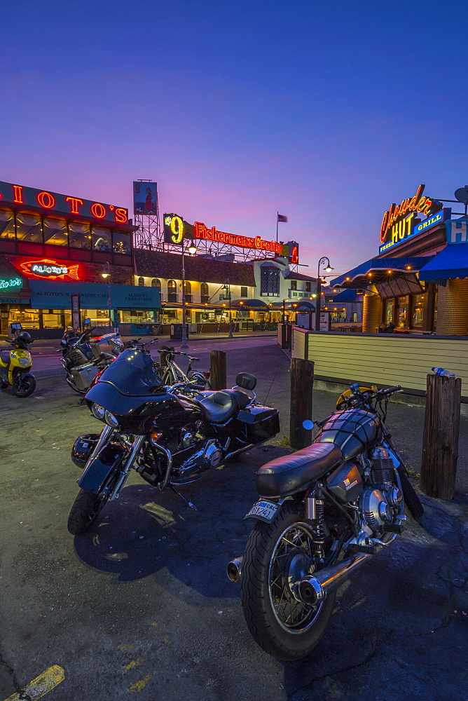 Motorbikes outside Fishermans Wharf cafes and restaurants at dusk, San Francisco, California, United States of America, North America