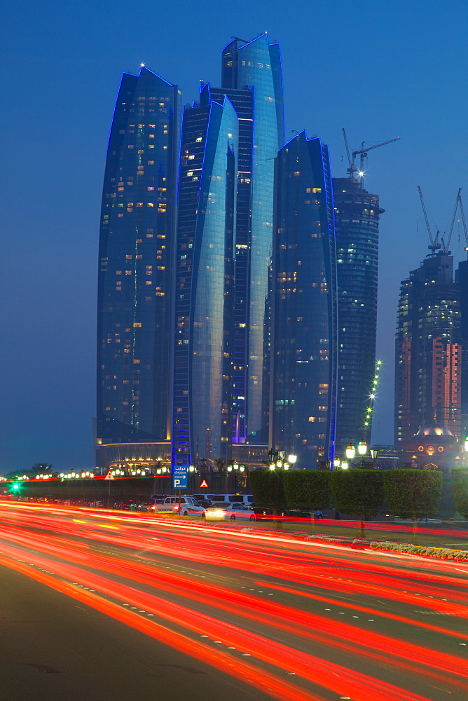 Emirate Towers and car tail lights at night, Abu Dhabi, United Arab Emirates, Middle East