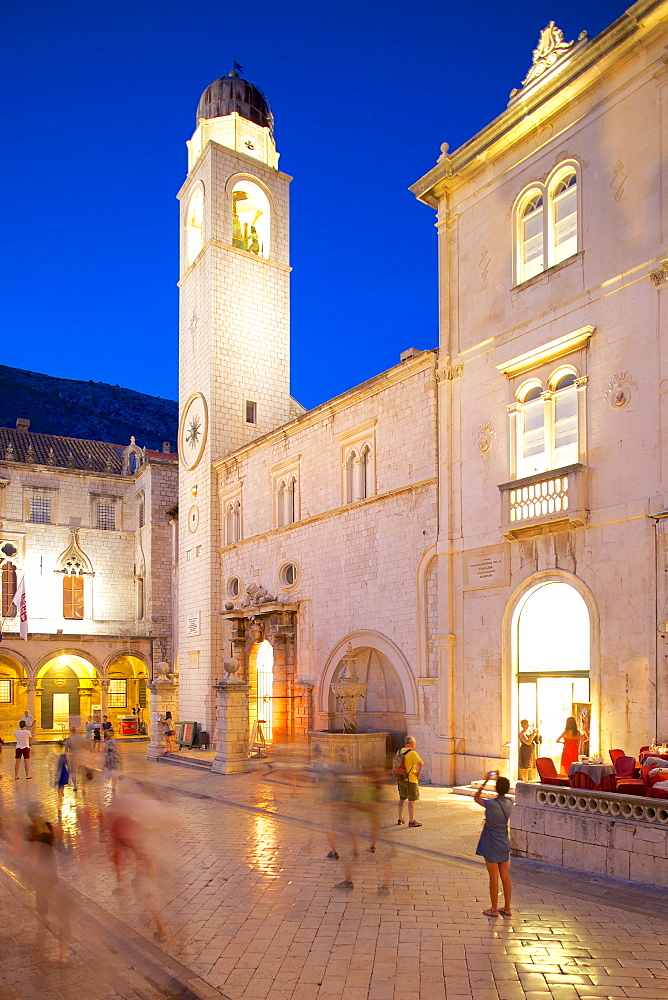 Clock tower and restaurants at dusk, Stradun, UNESCO World Heritage Site, Dubrovnik, Dalmatian Coast, Dalmatia, Croatia, Europe 